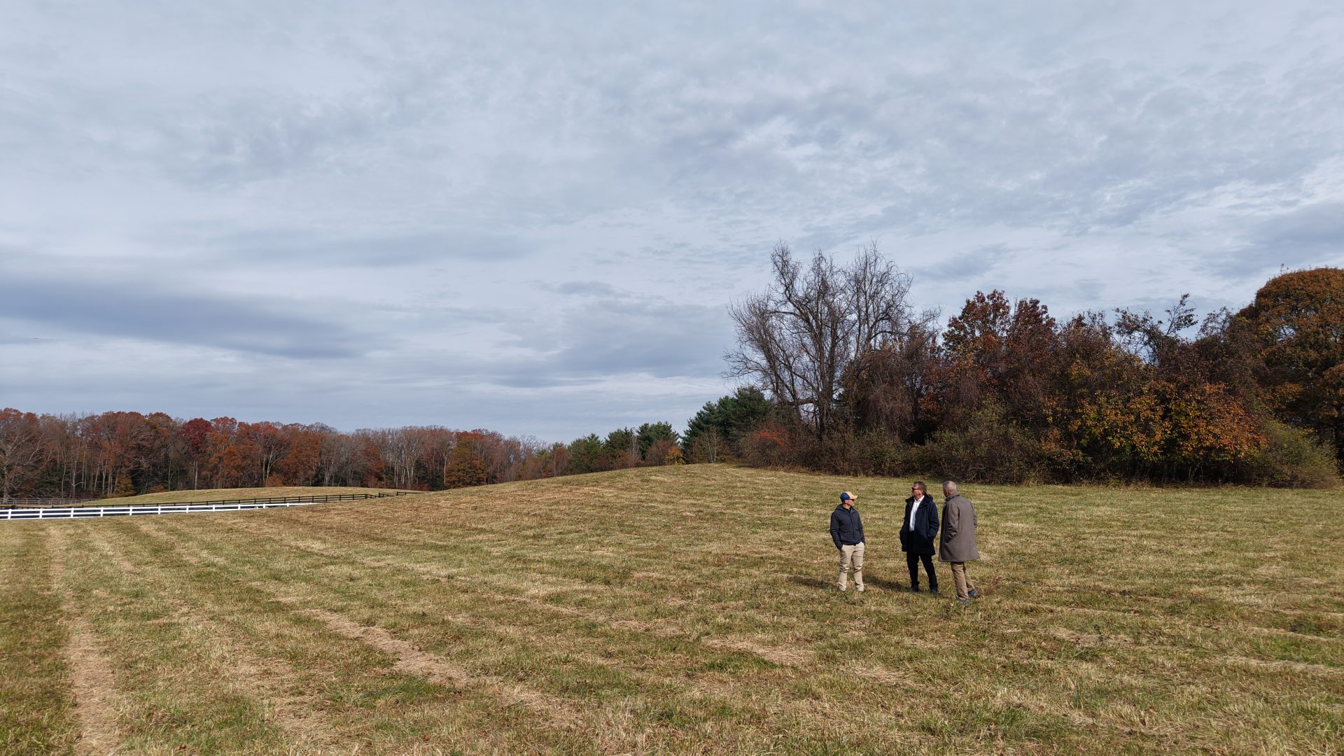 Annapolis Mayor Gavin Buckley joins landowner Brian Richardson and Scenic Rivers Executive Director Josh Falk for a walk at Mas Que Farm, now permanently conserved, to explore the property’s forest, farmland, and reforestation plans. (Photo Credit: Steve Tsiopanos for Scenic Rivers Land Trust)